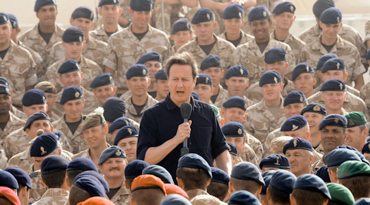 British Prime Minister David Cameron (C)